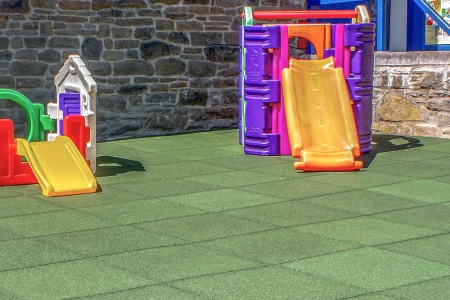 WARCO fall protection mats on a playground for small children.
