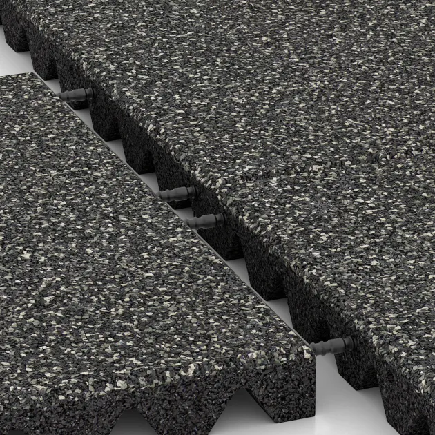 Großaufnahme vom Verbindungssystem von WARCO-Boden 5542 - Playground Safety Tile 4.5 cm - EN 1177 ≤ 135 cm im Farbdesign Dark Grey Granite. Abmessungen 500 x 500 x 45 mm.