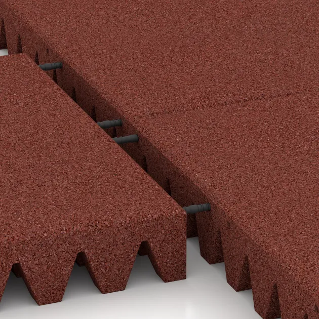 Großaufnahme vom Verbindungssystem von WARCO-Boden 0727 - Playground safety tile im Farbdesign Brick red. Abmessungen 500 x 500 x 80 mm.