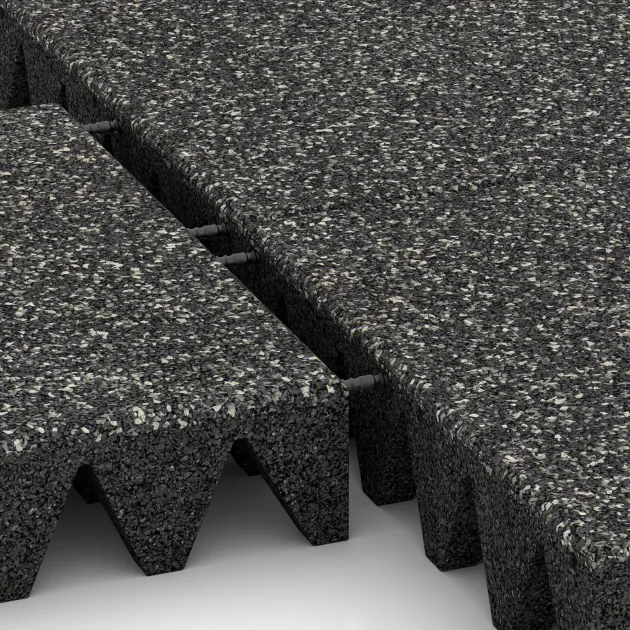 Großaufnahme vom Verbindungssystem von WARCO-Boden 3710 - Playground safety tile im Farbdesign Dark Grey Granite. Abmessungen 500 x 500 x 100 mm.