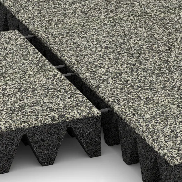 Großaufnahme vom Verbindungssystem von WARCO-Boden 5645 - Playground Safety Tile 10 cm - EN 1177 ≤ 300 cm im Farbdesign Light Granite. Abmessungen 500 x 500 x 100 mm.