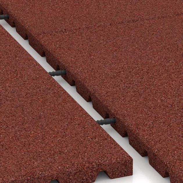 Großaufnahme vom Verbindungssystem von WARCO-Boden 0751 - Kick protection wall mat – impact protection mat im Farbdesign Brick red. Abmessungen 1000 x 1000 x 30 mm.