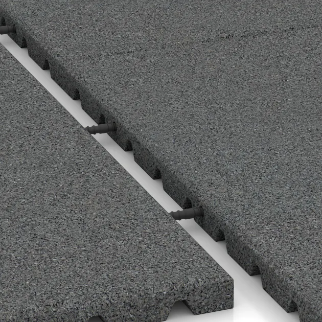 Großaufnahme vom Verbindungssystem von WARCO-Boden 0759 - Playground safety mat im Farbdesign Slate grey. Abmessungen 1000 x 1000 x 30 mm.