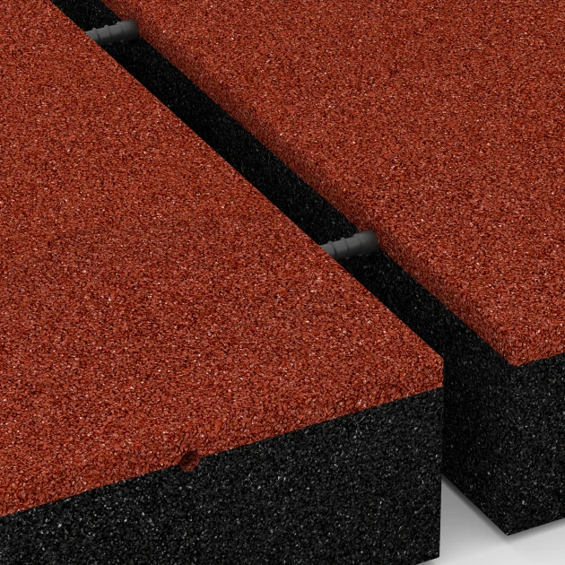 Großaufnahme vom Verbindungssystem von WARCO-Boden 6209 - Playground Safety Tiles im Farbdesign Brick red. Abmessungen 50 x 50 x 11 cm.
