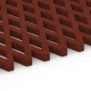 Großaufnahme vom Verbindungssystem von WARCO-Boden 7010 - Safety Grass Grid Mat im Farbdesign Brick red. Abmessungen 100 x 100 x 4 cm.